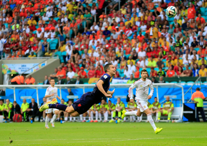 Illustration for article titled The Best Photos Of Robin Van Persie's Amazing Flying Header Goal